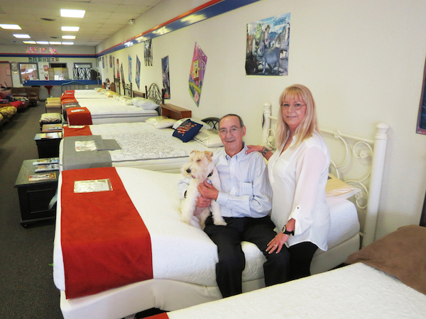 Molly and David ‘Slash’ Murray with Darcey at Mattress Exxpress in Aransas Pass. Darcey really runs the shop, claim the Murrays, who are just as devoted to their customers as they are to their canine. Staff photo