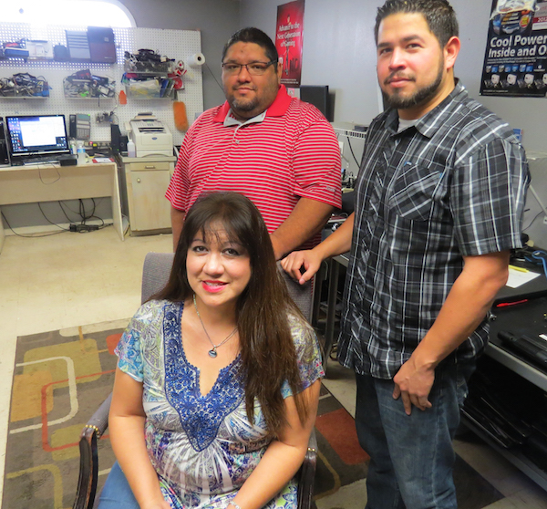 MindGames Computer Repair owner, Linda Gomez, with computer techs José Hinojosa (top left) and Chris Gomez at their the shop where all the computer repair magic happens. Staff photo