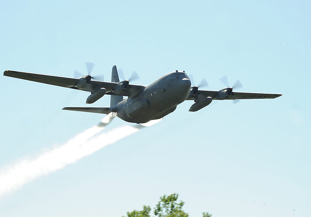 A C-130H cargo plane from the U.S. Air Force Reserves 910th Airlift Wing which is now spraying for mosquitos along the Texas Gulf Coast. The aircraft can dispense approximately 300 gallons a minute through its 12-nozzle system. (U.S. Air Force file photo/Airman 1st Class Zachiah Roberson)