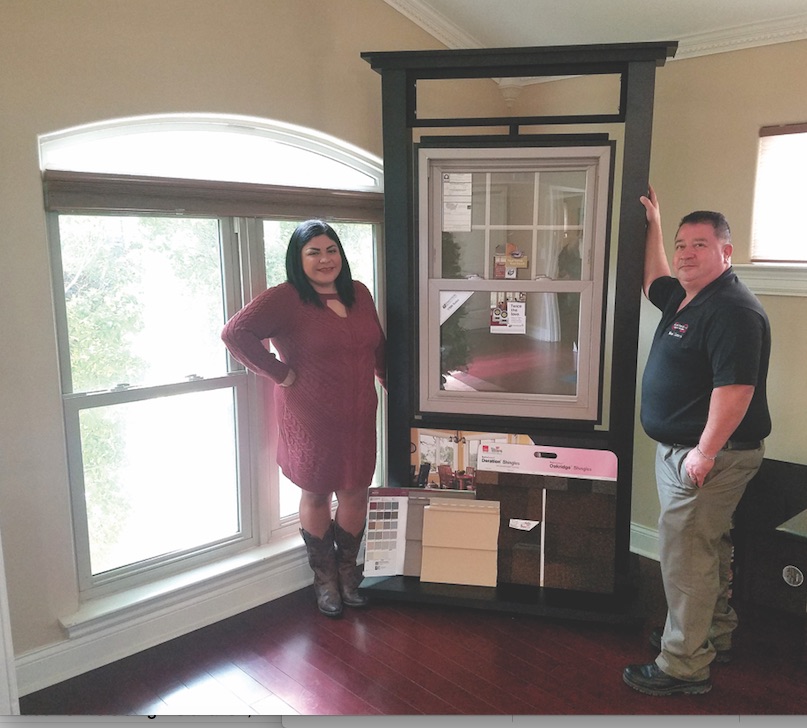 Brianna Chavarria and Manuel Chavarria Jr. in the showcase headquarters for Alpha and Omega Siding & Windows in Corpus Christi. The 15-year-old company has expanded over the year to include complete remodeling services. Photo by Jane Kathleen Gregoria