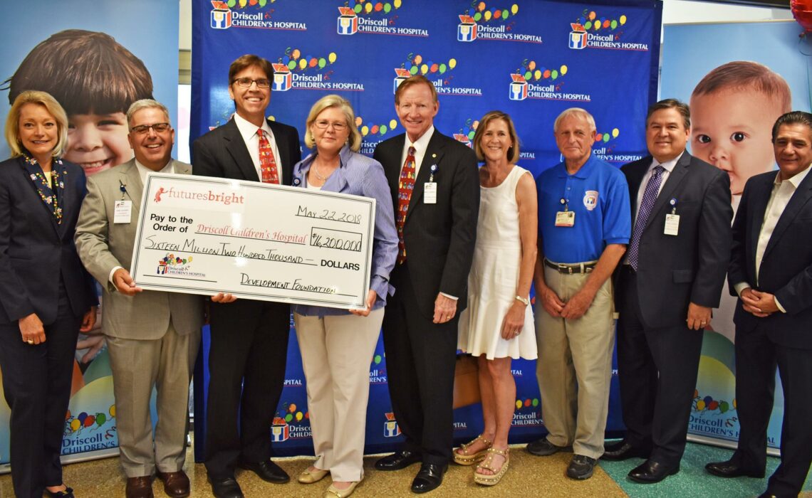 Representatives from Driscoll Children’s Hospital and its various boards accept a giant replica check of the $1 million the hospital is receiving from the J.E. and L.E. Mabee Foundation of Tulsa, Oklahoma. The contribution came as a reward for exceeding a challenge to raise $15 million for its FuturesBright hospital expansion fundraiser. Accepting the ceremonial check are Vice President of Development Martha Avery (left), Governing Board chairman Sam L. Susser, Driscoll Health System Interim President and CEO Eric Hamon, Governing Board trustee Mary D. Clark, Governing Board secretary Mike Carrell, Development Foundation director Susan Bonner, Driscoll Children’s Hospital auxiliary member Jake Jacobi, Governing Board vice chairman Paul Daniel Chapa, and Development Foundation director Andy Saenz.