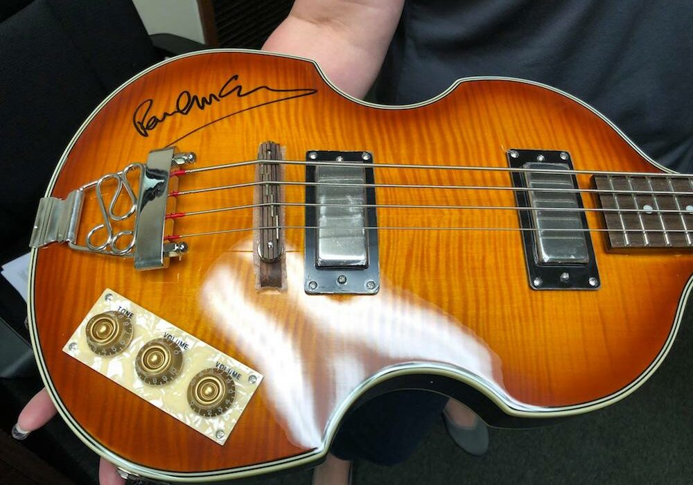 This bass guitar signed by Paul McCartney is just one of the many celebrity signatures (Willie Nelson, Michael Jordan, Muhammad Ali, Aretha Franklin, and more) available on instruments, albums, album covers, pictures, and posters at HELP Hits the High Notes fundraiser and silent auction Oct. 24 at Brewster Street Ice House. Courtesy Photo Hammons Education Leadership Program
