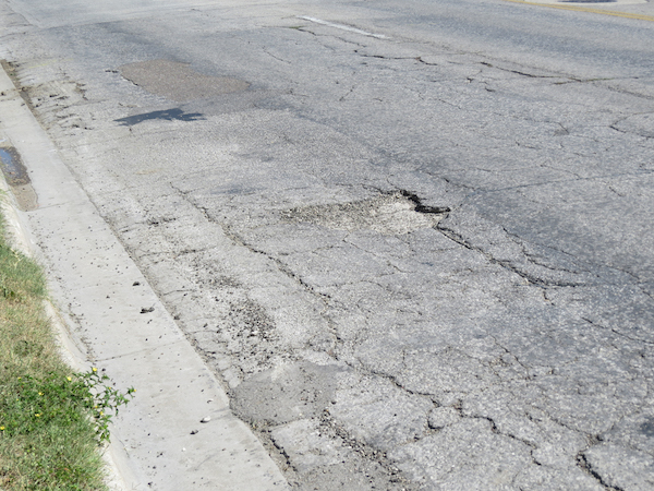 Type B funds can be used to pave arterial and collector streets that, if not fixed, would otherwise discourage investment and development. Photo by Nickie Snow Stillman