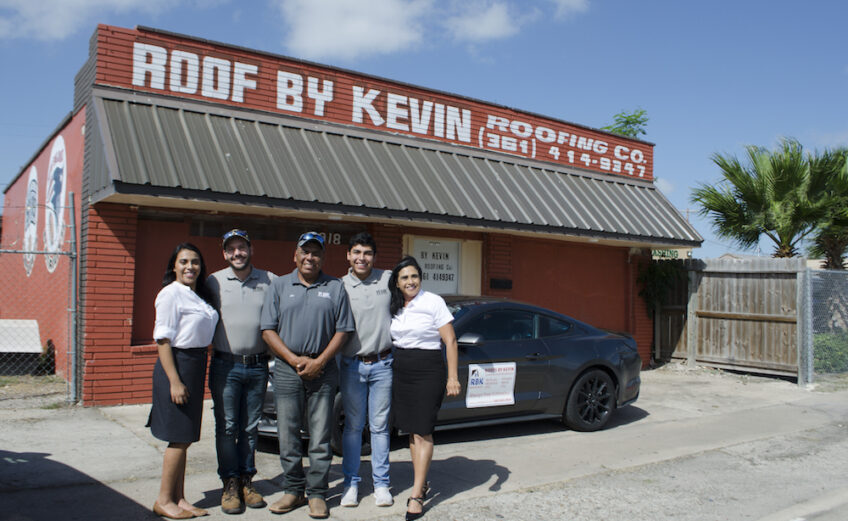 In front of its building at 3918 Baldwin Blvd. is the team from Roofs by Kevin: Andrea Parra (left), Paul Teltschik, Jose Parra, Kevin Parra and Martha Parra. Currently under renovation, the building should be completed by the end of summer. Photo by Jane Kathleen Gregorio