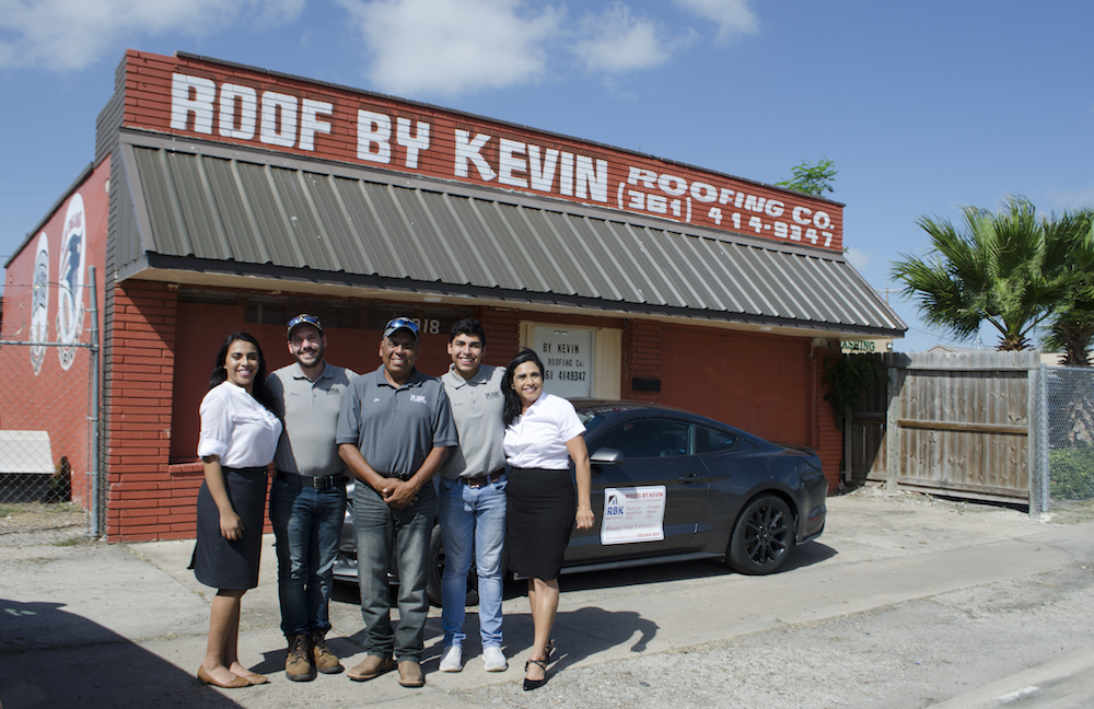 In front of its building at 3918 Baldwin Blvd. is the team from Roofs by Kevin: Andrea Parra (left), Paul Teltschik, Jose Parra, Kevin Parra and Martha Parra. Currently under renovation, the building should be completed by the end of summer. Photo by Jane Kathleen Gregorio