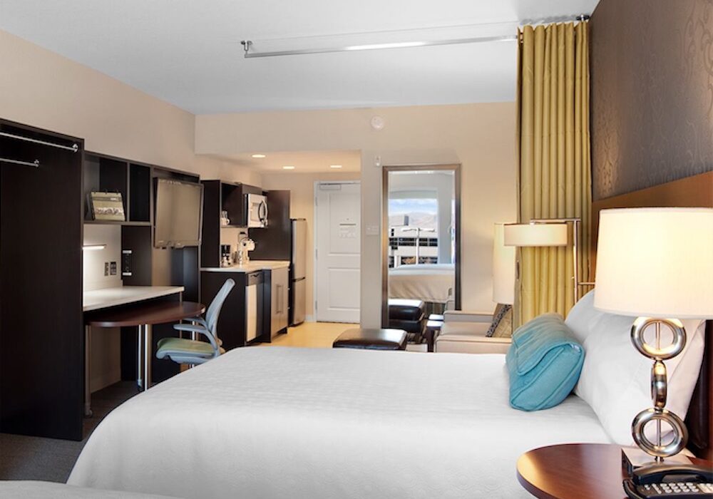 The rooms in a Home2 Suites by Hilton include work stations, kitchens, and a lounge area. Doors can be locked and unlocked by smartphone. Courtesy photo