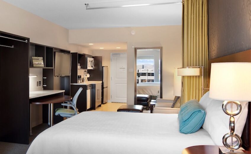 The rooms in a Home2 Suites by Hilton include work stations, kitchens, and a lounge area. Doors can be locked and unlocked by smartphone. Courtesy photo