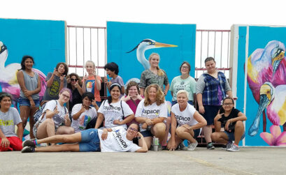 Young artists participating in the K Space Summer Mural Arts Program pose with a mural they created during the summer of 2017 at a downtown parking garage. Courtesy photo from K Space Contemporary website