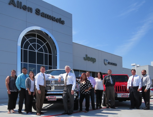 Outside the new Allen Samuels Chrysler Dodge Jeep Ram dealership in Aranasas Pass are (center in front of truck) Bill Denton, president and general manager, and Allen Samuels, owner, along with a portion of their sales team. The new state-of-the-art sales and service center are located at 877 South Highway 35 Bypass in Aransas Pass. Staff Photo