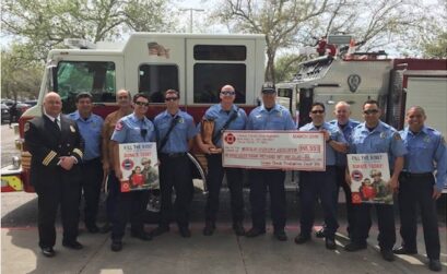 Members of the Corpus Christi Professional Firefighters Association present a giant check for $105,000 to the Muscular Dystrophy Association after the 2018 Fill the Boot fundraising efforts. Courtesy photo