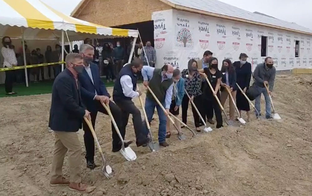 Officials line up to turn the dirt at groundbreaking ceremonies for The Ranch, a 24-home neighborhood for foster children and their families being built by the nonprofit Agape Ranch. Ceremonies were held Jan. 20. Screen-captured image