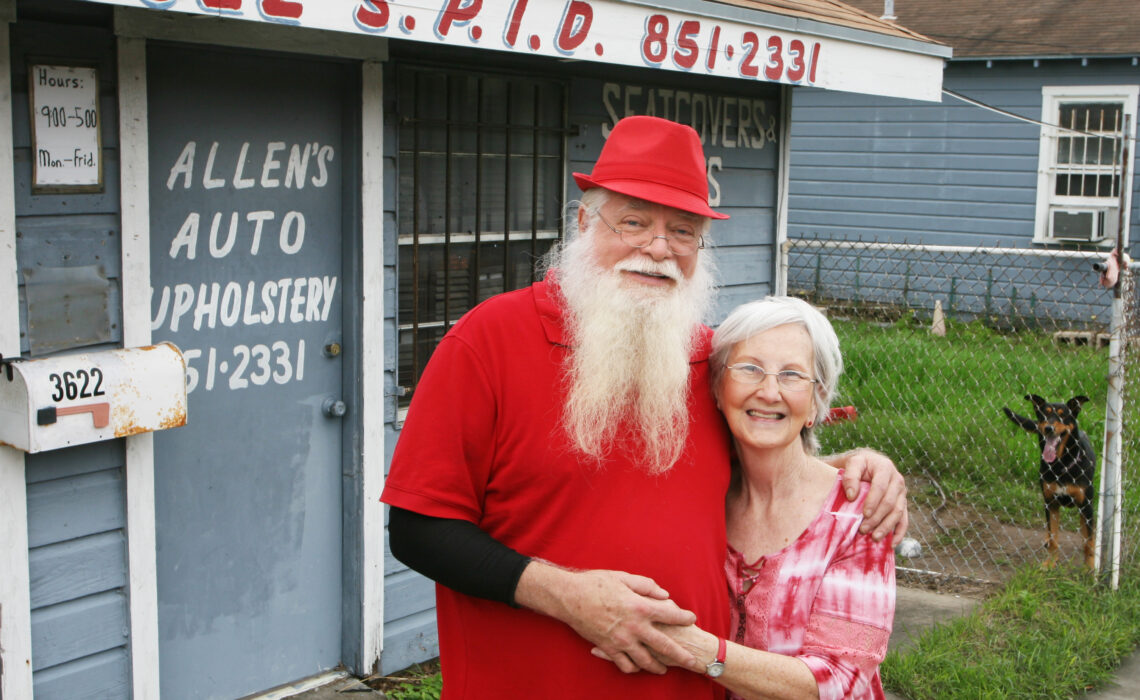 Mr. and Mrs. Allen Roy are sometimes known as Mr. and Mrs. Claus, especially during the Christmas holidays. Owner of Allen’s Auto Upholstery, Roy wears red year-round. Photo by Carrie Robertson Meyer