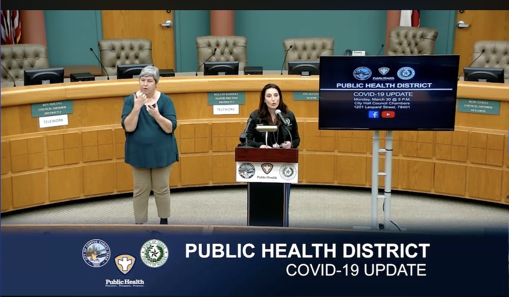 Nueces County Judge Barbara Canales announced the county’s new COVID-19 hotline number — 361-441-6000 — as Lucy James interprets her remarks in American Sign Language. Screen capture