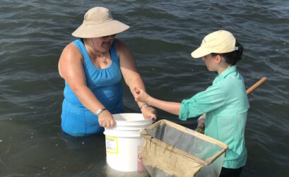 Volunteers Melissa and Elsa Temples collect marine samples as participants in 2019 Texas BioBlitz. Photo Courtesy Kelley Savage