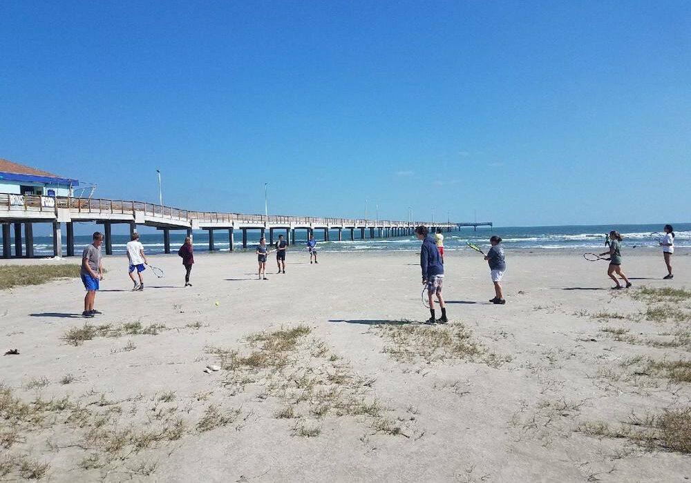 The Port Aransas High School tennis team takes practice to the beach after returning to school October 16. Classes are being conducted in portable buildings while the school district rebuilds after Hurricane Harvey destroyed the campus. As of the middle of the first week of back to school, enrollment was just over 80 percent of what it was when the school evacuated August 25. Photo courtesy Port Aransas ISD