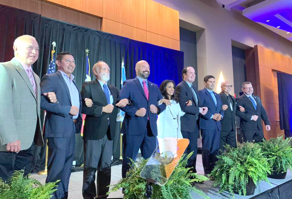 Corpus Christi City Council members take the stage with Mayor Paulette Guajardo on Thursday, July 15, at her first State of the City address. The council includes (from left) Mike Pusley, at-large; Ben Molina, District 2; Greg Smith, District 4; John Martinez, at-large; Mayor Guajardo; Michael Hunter, at-large; Gil Hernandez, District 5; Billy Lerma, District 1; and Roland Barrera, District 3. Courtesy photo