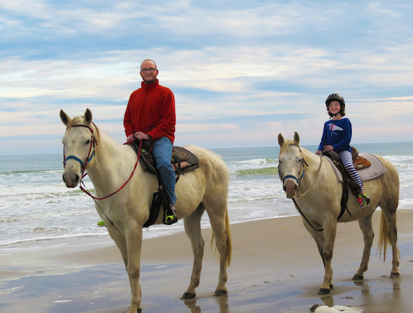 Nine-year-old Caroline Crocker-Kozar (right) of Amarillo described her Horses on the Beach sunset ride with her father, Steven Cocker, as ‘amazing!' The ride was part of a birthday celebration at the Padre Island beachside ranch.