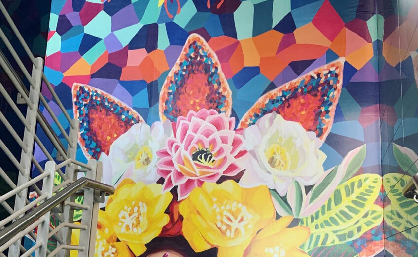 A new mural by artist Sandra Gonzalez graces a staircase inside the Port of Corpus Christi administration building. The mural is one of two of the city’s latest additions to its growing collection. Courtesy photo