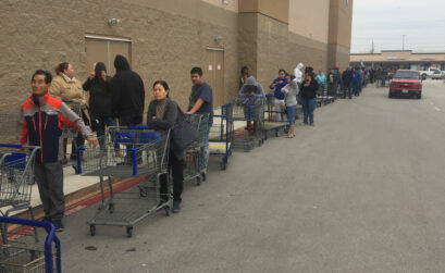 Corpus Christi residents line up outside Sam's Club on South Padre Island Drive Dec. 15, waiting for a shipment of bottled water to arrive. Stores quickly sold out after the city issued a no-use ban on tap water that lasted four days. Photo by Roland Chiapoco
