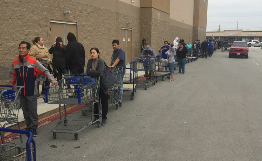 Corpus Christi residents line up outside Sam's Club on South Padre Island Drive Dec. 15, waiting for a shipment of bottled water to arrive. Stores quickly sold out after the city issued a no-use ban on tap water that lasted four days. Photo by Roland Chiapoco