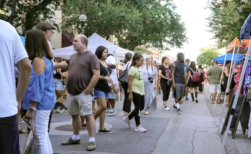 Popup tents provided plenty of space for vendors to offer their wares in an outdoor setting at a past Corpus Christi ArtWalk. Visitors enjoy tasty Texas treats while shopping and listening to live music at the monthly event. Courtesy photo