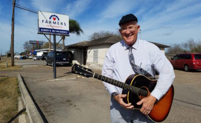 Aubrey Bryan with his prized possession, a 1965 Gibson J-45 guitar, the same type used by Elvis Presley. Bryan purchased his in 1967 from a San Antonio music store. It’s still in good condition. Photo by Jane Kathleen Gregorio