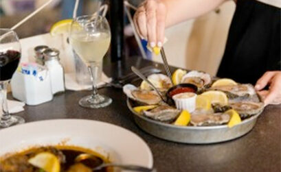 Customers at Water Street Seafood enjoy a plate of Gulf oysters on the half shell, a local speciality that is fairly scarce this season because of the closing of Copano Bay to harvesting. Oyster beds in the bay need the season break to rejuvenate says an expert at the Texas Parks and Wildlife Department. Courtesy Photo