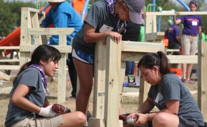 Marisa Herrera (left), Randi Villarreal and Analisa Cortinez, all city of Corpus Christi Latch Key employees, help build a deck bench for the new playground at Dilworth Park on Nov 5. Photo by Carrie Robertson Meyer/Third Coast Photo