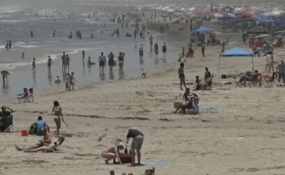 This screenshot was taken from a San Antonio TV news station's footage of the beach in Port Aransas on Memorial Day weekend. Beaches in Port Aransas and Corpus Christi were packed for the long weekend, which experts believe led to a surge in COVID-19 cases that put the city in The New York Times as the top city in the nation for positive cases per capita.