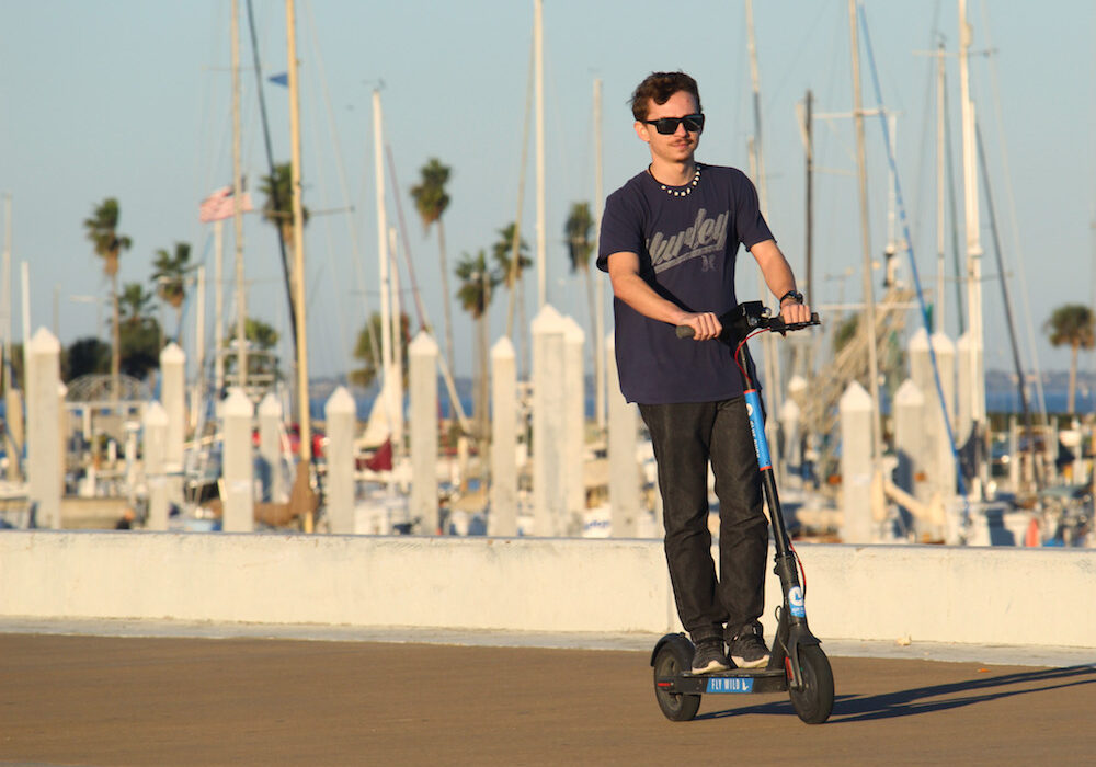 Adrian Garcia, 19, of North Beach in Corpus Christi rides a Blue Duck scooter along the seawall in downtown Corpus Christi. Blue Duck scooters are free during the month of January as a promotion to show just how useful and fun scooters can be in the city. Photo by Carrie Robertson Meyer