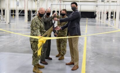 At the Aug. 27 ribbon cutting for the Corpus Christi Army Depot’s new Powertrain Transmission Assembly Building were Naval Air Station-Corpus Christi Public Works Officer Cmdr. Eric Hass (left), NASCC Commanding Officer Capt. Chris Jason, Corpus Christi Army Depot Commanding Officer Col. Joseph Parker, and district manager and vice president of Hensel Phelps Construction Company, Brad Winans. Photo By Sean Dath, courtesy CCAD