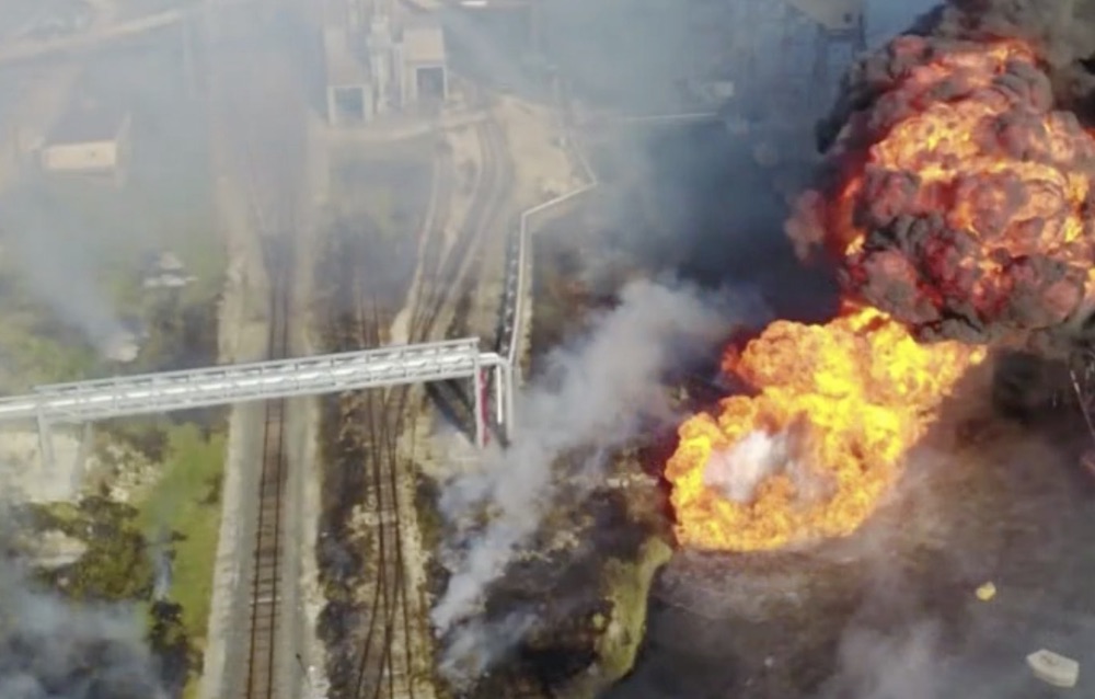 A private contract dredging vessel hit a propane pipeline in the Corpus Christi ship channel Aug. 21, killing four people and injuring six others. Cleanup continued on Monday, Aug. 24, as the U.S. Coast Guard called off the search for the bodies of two of the four presumed dead. Screen captured image