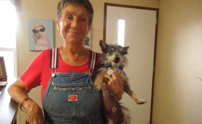 Peewee’s Pet Adoption World & Sanctuary Shelter Director Ernie Cochran with her shelter mascot dog, Jafar. Photo by Dayna Worchel