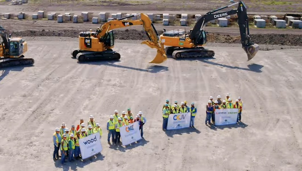 Backhoes stand ready to dig into the earth during groundbreaking ceremonies September 12 at the ExxonMobil-SABIC plastics plant being built in Gregory near Corpus Christi. About 200 local officials watched on screen from inside the Orientation and Training Center on site. Courtesy photo