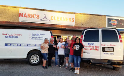The professionals at Mark’s Cleaners include Janie (left), Olga, Toni, Judy, Tracy, owner Mark Arnold and Noeila. Photo by Jane Kathleen Gregorio