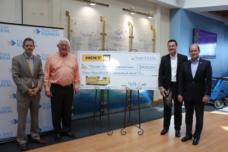 HOLT-Cat donated $400,000 for a generator for the new Caribbean Journey building and Dolphin Bay. A symbolic giant check was presented during a press event Sept. 20, 2016. Courtesy photo