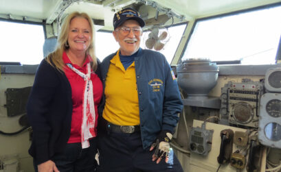 USS Lexington Museum on the Bay volunteer coordinator Debbie Cooper shares a laugh with volunteer Bob Perry. Staff Photo