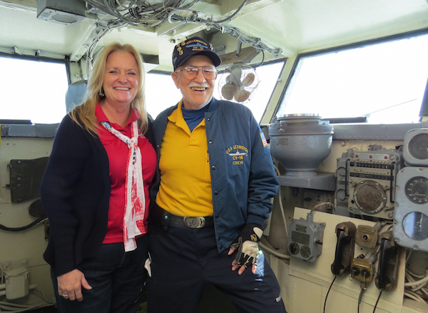 USS Lexington Museum on the Bay volunteer coordinator Debbie Cooper shares a laugh with volunteer Bob Perry. Staff Photo