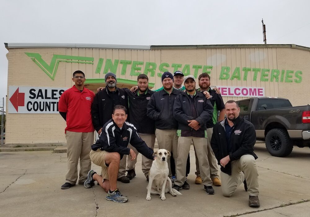 Owner, J.D. Jones (front, left) and Operations Manager Jon Groves (front, right) with the team of Interstate Batteries experts ‘ever ready’ to keep Coastal Bend vehicles and devices charged and running. Photo by Jane Kathleen Gregorio