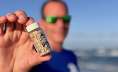 Jace Tunnell of the University of Texas Marine Science Institute holds up a container filled with nurdles found on Coastal Bend beaches. The founder of Nurdle Patrol, Tunnell was recently awarded $1 million to help in his research. Nurdles are plastic pellets used to create everything plastic. Courtesy photo