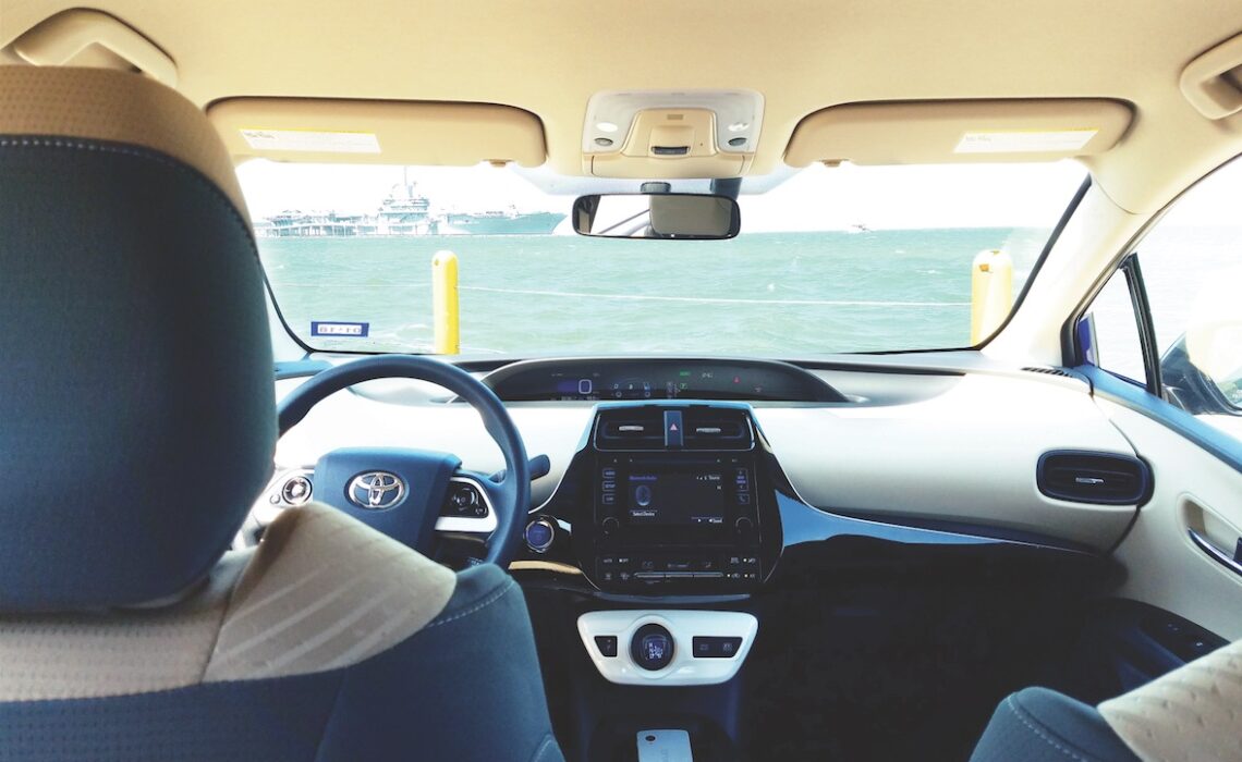 The interior of the Toyota Prius Two Eco sports attractive cloth seating with firm, but wide, bolsters. The test car’s contrasting black-and-beige interior brings high style to the green set. Photo by Adam Barrera