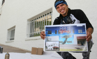Muralist Jeremy Flores displays the artwork he created of a sea turtle making its way across the sand to the Gulf of Mexico. The illustration will be painted on the wall behind him during CC Street WAVE on July 14-16 in downtown Corpus Christi. Photo by Carrie Robertson Meyer/Third Coast Photo