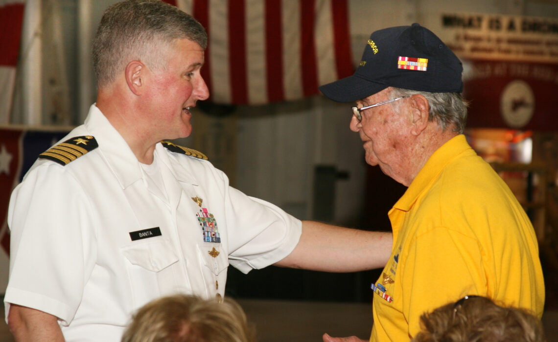 Navy commander Steve Banta greets Pearl Harbor survivor Bob Batterson during the Salute to Veterans ceremony held at the USS Lexington on Veterans Day, Nov. 11, 2017. Banta took over as director of the USS Lexington Museum on the Bay in February 2018. Photo by Carrie Robertson Meyer/Third Coast Photo