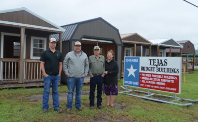 Josh Boyd (left), Steven Rives, and Kenneth and Joyce Rives in front of just a few of the sturdy, durable buildings they offer at Tejas Budget Buildings in Corpus Christi. Photo by Jane Kathleen Gregorio