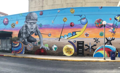 A stunning mural engulfs K Space Contemporary’s outdoor facade, which before was only white. Designed by Tony Armadillo, the mural was painted by teens at the gallery’s summer camp under the auspices of Sandra Gonzales. Photo by Roland Chiapoco