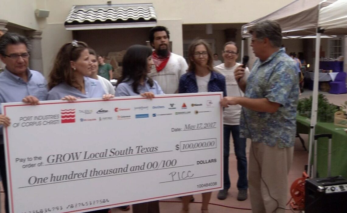 Members of GROW Local South Texas accept a $100,000 check from Port Industries of Corpus Christi during a presentation at one of its Wednesday Farmers Markets. Open from 5 to 8 p.m.. every Wednesday, the Downtown Farmers Market is held in the courtyard at the Art Center of Corpus Christi, 100 N. Shoreline Blvd. Courtesy photo