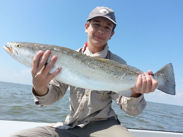 Brandon Gill, 15, proudly holds up a speckled trout caught on a sinking lure, which takes skill and practice to do well, said his father, Dr. John Gill of Corpus Christi. Courtesy photo