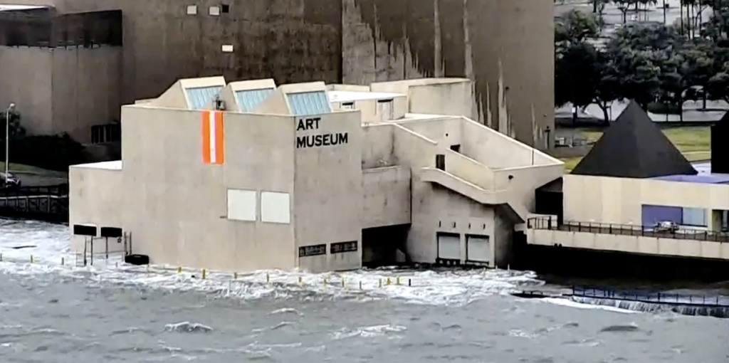 A storm surge of about 5 feet flooded the first floor of the Art Museum of South Texas as Hurricane Hanna made landfall at 5 p.m. Saturday, July 25, 2020. A dolphin was spotted in the flooded parking lot. Screen capture from USS Lex camera, KIII TV