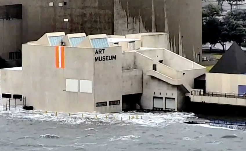 A storm surge of about 5 feet flooded the first floor of the Art Museum of South Texas as Hurricane Hanna made landfall at 5 p.m. Saturday, July 25, 2020. A dolphin was spotted in the flooded parking lot. Screen capture from USS Lex camera, KIII TV