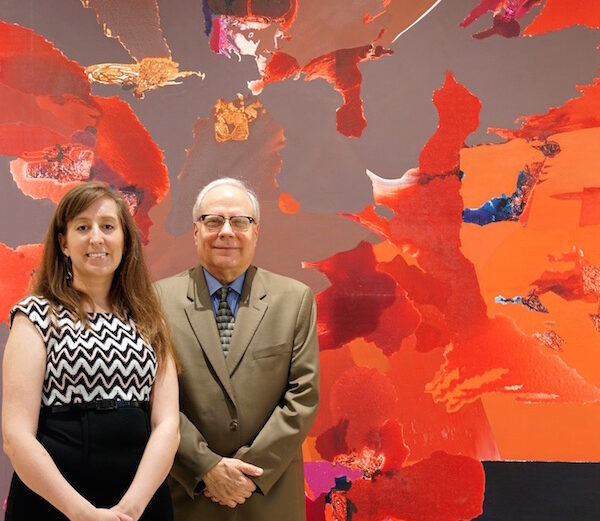 Director of the Art Museum of South Texas Joe Schneck and communications director Karol Stewart assess the installation progress of an exciting new interactive exhibit, “Dorothy Hood: The Color of Being/ El Color del Ser,” which is now open. The show goes on the road after Jan. 8, 2017. Photo by Jon Brandt Photography
